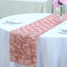 PRICES MAY VARY. Add oodles of flair and character in your party with our enticing raised rosette table runner, which is simply breathtaking. The very sight of this floral ecstasy will bring the divine vision of a paradise garden with its whimsical blossoms and luster into your event/celebration. For those special and rare celebrations that need to have an extra doting touch in their ambiance decoration, this top-notch rosette linen is a picture perfect choice. The lustrous texture and hue of th Satin Table Runner, Satin Ribbon Roses, Pew Bows, Spring Wedding Decorations, Aisle Runner, Satin Roses, Banquet Tables, Ribbon Roses, Rose Style