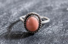 Coral Ring set with a Natural Angel Skin Coral in a pink/orange rare natural color, this top quality Coral is sourced from Sardinia Italy (Coral size 10x8mm, 3 Carats). Vintage Ring design is made of Solid 925 Sterling Silver (no “coating" ☞ only Solid Pure Silver - made to last). March Birthstone - Genuine & Natural Stone ❀ ⌛Last Ring left ⌛ Matching Earrings & Pendant - please ask me, ☞ Choose your size ☞ I resize (before shipping) for FREE to Any size* ❀ Natural Stones jewelry have Slight var March Birthstone Ring, Solitaire Ring Set, Angel Skin, Victorian Ring, Vintage Silver Rings, Sardinia Italy, Coral Ring, Natural Coral, Victorian Rings