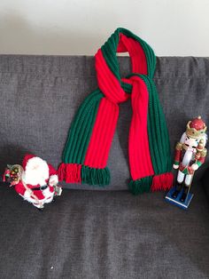 a scarf, toy and nutcracker sitting on a couch