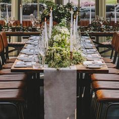 the table is set with candles and place settings