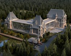 an aerial view of a large building surrounded by trees