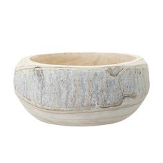 a bowl that is sitting on top of a white surface with an animal design in the center