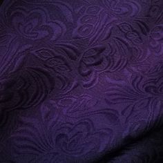 the purple fabric has an intricate design on it