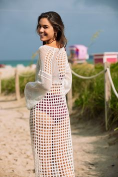 Stella is a long crochet white cover-up. One size only, and will fit comfortably up to a size 8. Length from shoulder to bottom 52”. one size shoulder to bottom length: 52" (133cm) sleeves length: 21" (54cm) 100% cotton Long Sleeve Crochet Cover-up For Vacation, White Crochet Bohemian Cover-up, White Crochet Beachwear Cover-up, White Bohemian Long Crochet Dress, White Long Bohemian Crochet Dress, White Long Sleeve Bohemian Crochet Dress, White Crochet Lace Top For Beach Cover-up, Bohemian Crochet Dress With Open Knit For Day Out, White Crochet Lace Dress For Beach Cover-up