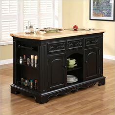 a black kitchen island with marble top and drawers on the bottom, in front of a white background