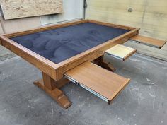 a wooden table with blue cloth on top