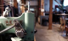 an old sewing machine is sitting on the table