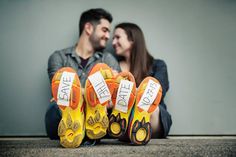 a man and woman sitting next to each other with yellow shoes