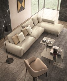 a living room with a large sectional couch and coffee table