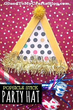 a party hat made out of popsicle sticks