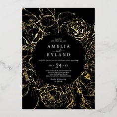 an elegant black and gold wedding card with roses on the front, in white marble