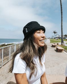 Introducing the Sand Cloud Bucket Hat, a must-have for your sunny adventures. This hat features a beautifully embroidered white Sand Cloud logo and a stylish 2-inch flap, perfect for adding both flair and sun protection to your look. Made from 100% cotton; fits most. Approx size : 56cm Women's Fit Color : Black Bucket Hat Unisex with Flat Sand Cloud Round Icon Embroidery in White 100% Cotton Made in China Care Details: Machine Wash Cold Delicate Cycle Do Not Bleach Hang Air Dry Do Not Iron Do No Cloud Bucket Hat, Cloud Logo, Sand Cloud, Black Bucket Hat, Black Bucket, Marine Conservation, Body Sunscreen, Enjoying The Sun, Instagram Icons