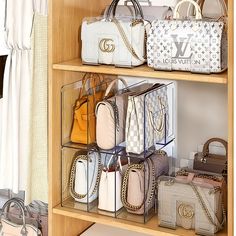 several purses and handbags on shelves in a closet