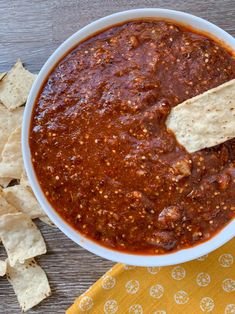 copycat chipotle spicy salsa in a bowl with tortilla chips