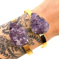 Approximate gem size: 3 x 2 Cm Cuff length without gap: 18 Cm - gap can be enlarged up to 6 Cm Cuff material: 18k gold plated brass. Weight: 20g ( Conversion: 1 inch = 2.5 Cm ) You will receive ONE bracelet selected at random. Colors, shapes, and sizes vary slightly. Please measure your wrist prior to purchasing to ensure that the cuff size will fit.  Please note that this is a natural product, sometimes stones and crystals have small imperfections and blemishes. Make sure to double check measur Amethyst Cuff Bracelet As Gift, Amethyst Cuff Bracelet In Purple For Gift, Purple Amethyst Cuff Bracelet Gift, Adjustable Purple Bangle With Gemstone, Adjustable Purple Gemstone Bangle, Adjustable Purple Gemstone Cuff Bracelet, Spiritual Amethyst Cuff Bracelet In Purple, Spiritual Purple Amethyst Cuff Bracelet, Cristal Bracelet