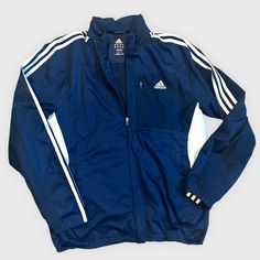 Brand: Adidas Rn # 88387 Size: Unisex Small ( S ) Color: Navy With White Stripes And Accents Zip Closure With 3 Pockets Inside Is A Mesh Material. Outside Is 100% Polyester. Machine Washable And Dryer Safe. Adidas Long Sleeve Windbreaker With Three Stripes, Blue Adidas Windbreaker For Spring, Adidas Blue Windbreaker For Spring, Adidas Blue Spring Windbreaker, Navy Adidas Long Sleeve Track Jacket, Adidas Navy Long Sleeve Track Jacket, Adidas Navy Sports Outerwear, Navy Adidas Sports Outerwear, Navy Adidas Outerwear For Sports