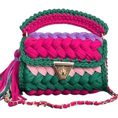 a multicolored handbag with a tasselled handle