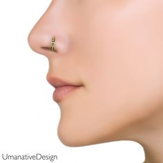 a woman's nose with an ear piercing