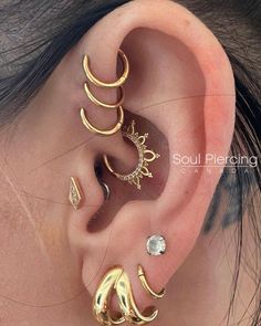 three different types of ear piercings are shown in this image, one is gold and the other is silver