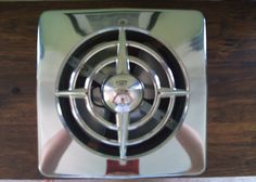 an old style stove top on a wooden table