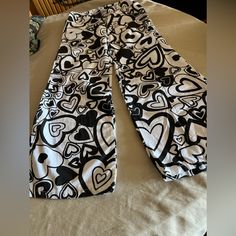 Juniors Black And White Heart Pants Size: Europe Size 36 Brand New White Stretch Y2k Bottoms, White Heart Print Bottoms For Summer, Fitted Cotton Bottoms With Heart Print, Casual White Bottoms With Heart Print, Casual Long Pants With Heart Print, Cute Stretch White Pants, Casual Cotton Bottoms With Heart Print, White Cotton Bottoms With Heart Print, Heart Pants