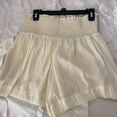 Super Cute Cream Smocked Shorts From The Pants Store!! So Flattering And Comfy! Tags Taken Off But Never Worn! Summer Smocked Top With Stretch And Elastic Waistband, Stretch Smocked Top With Elastic Waistband For Summer, White Vacation Bottoms With Smocked Back, White Summer Bottoms With Smocked Back, White Smocked Back Bottoms For Vacation, Chic Smocked Top With Smocked Cuffs For Beach, Chic Smocked Top For Day Out With Elastic Waistband, Chic Smocked Top With Cuffs For The Beach, Chic Smocked Cuffs Top For Beach