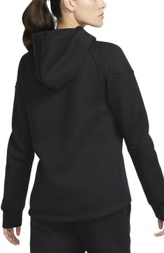 Stay cozy and warm without the extra bulk in a full-zip hoodie made from lightweight tech fleece and finished with convenient zippered pockets. 25" front length; 27" back length (size medium) Front zip closure Fixed hood Front zip pockets 53% cotton, 47% polyester Machine wash, tumble dry Imported Nike Sports Hooded Jacket With Ribbed Cuffs, Nike Sports Outerwear With Kangaroo Pocket, Hooded Fleece Track Jacket For Athleisure, Nike Sporty Sweatshirt With Fleece Lining, Black Hooded Activewear For Outdoor Activities, Fleece Track Jacket With Drawstring Hood, Sports Hooded Jacket With Kangaroo Pocket For Fall, Half-zip Fleece Hoodie Sportswear, Fall Sports Hooded Jacket With Kangaroo Pocket