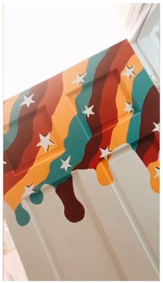 a close up of the side of a door with stars painted on it