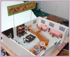 a doll house with furniture and decorations on the top floor is shown in full view