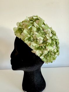 "Vintage 1960s Green pillbox style hat with floral detailing all over. Hat features  wonderful green flowers all over with pearlesque stems throughout. This hat is a wonderful example of 1960s Mod style and is highly collectible.  Hat would be perfect for garden parties or summertime soirées.  The inner lining of the hat is a matching green and there are no stains. IN PERFECT VINTAGE CONDITION WITH NO DEFECTS TO NOTE. MEASUREMENT: Inner Circumference: 21\"/ 53cm Width: 8\"/20cm Height: 4\" /10cm" Vintage Garden Party, Vintage Garden Parties, Beaded Pouch, 1960s Mod, Mod Style, Pillbox Hat, Garden Parties, Evening Purse, Mod Fashion