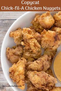 fried chicken nuggets with dipping sauce in a white bowl