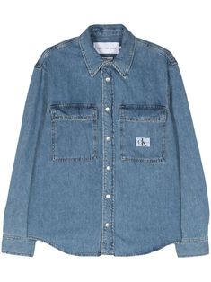 blue cotton denim logo patch at the chest contrast stitching classic collar front press-stud fastening long sleeves turn-up cuffs two chest flap pockets curved hem Patch Denim, Jeans Logo, Denim Patches, Contrast Stitch, Calvin Klein Jeans, Denim Shirt, Patch Logo, Calvin Klein, Top Brands