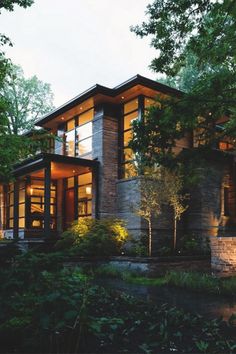 a modern house in the woods at dusk