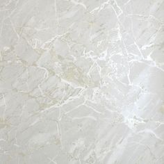 a white marble textured surface with gold veining