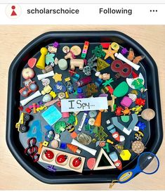 a black tray filled with lots of different types of toys