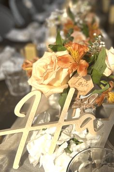 the table is set with flowers and candles