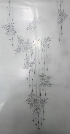 a drawing of flowers on a sheet of paper with writing in the middle and bottom