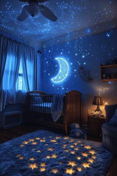 a baby's room with blue walls and stars on the ceiling