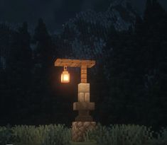 an image of a lantern in the middle of a night time scene with trees and bushes