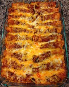 a casserole dish with meat and cheese in it on a counter top, ready to be eaten