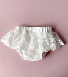 Ivory baby girl bloomers. The fabric is  natural cotton. You can order all matching baptism out: dress, headband, shoes. Please, use the links: *dress: https://www.etsy.com/listing/1462594915/baptism-dress-for-baby-girl-christening?click_key=016383318fba970c06c0fcf867711d818790fd98%3A1462594915&click_sum=f7ffb1fd&ref=shop_home_active_1&frs=1&sts=1 *headband: https://www.etsy.com/listing/1462604251/christening-headband-lace-bow-ivory?click_key=71867b64df5cee90583fc6a9a97439f613ed7c46%3A1462604251&click_sum=71da5b62&ref=shop_home_active_1&frs=1&sts=1 *shoes: https://www.etsy.com/listing/1462601197/ivory-baptism-shoes-christening-booties?click_key=b6c66491f006a0ea975d24fcb95094905e0285b3%3A1462601197&click_sum=39c96ce3&ref=shop_home_active_1&frs=1&sts=1 Wash & care instructions: Steam out the White Lace Ruffled Bottoms, White Lace Baptism Dress With Ruffles, White Lace Bottoms For Weddings, White Lace Wedding Bottoms, Summer Baptism Dress With Lace Work, Cute Lace Baptism Dress, Cute Lace Baptism Dress With Lace Trim, White Elegant Baptism Dress For First Birthday, Elegant White Baptism Dress For First Birthday