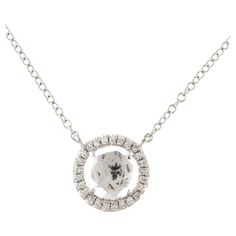 This White Topaz & Diamond Pendant is a stunning and timeless accessory that can add a touch of glamour and sophistication to any outfit. This pendant features a 1.25 Carat Round White Topaz, with a Diamond Halo comprised of 0.06 Carats of Single Cut Round White Diamonds. This pendant is set in 14K White Gold, and the diameter measures out at 9MM. White Gold Pendant Necklace, Round Pendant Necklace, Timeless Accessories, Round Pendant, Gold Pendant Necklace, White Topaz, Halo Diamond, Diamond Pendant, Diamond White