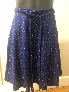 For sale is a vintage blue floral skirt from the 70s or 80s. Tag reads 100% Baumwolle, which is cotton in German. Tag says 38 but I think it is more a Eur 34-36 so an Aus/UK size 8 or US size 4-6. Please check the actual measurements below. Skirt is lined with side zip and ties at waist. Colours are vibrant, skirt is lined. Excellent condition. Measurements: Across waist - 35cm/ 13 3/4 inches Length - 52 cm/ 20 1/2 inches Cotton A-line Skirt With Floral Print, Blue A-line Cotton Bottoms, Blue A-line Cotton Skirt, Vintage Cotton Dresses With Lined Skirt, Blue Cotton Dress With Gathered Skirt, Retro Blue Cotton Skirt, Vintage Blue Flared Skirt, Vintage Dresses With Relaxed Skirt For Spring, Knee-length Cotton Skirt With Floral Print