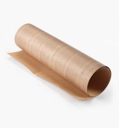 a roll of brown paper sitting on top of a white surface