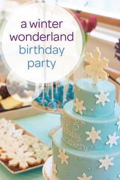 a birthday party with blue and white frosted cake, cookies and other desserts