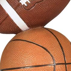 a close up of a basketball on top of another one with a white line down the middle