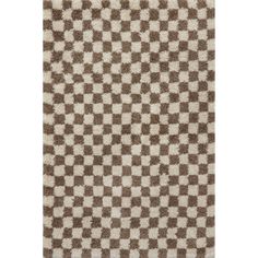 a brown and white rug with checkered pattern on the bottom, it's very soft