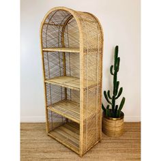 Vintage 1970s Boho Chic Rattan Shelf  arched top made of rattan/wicker material 4 open shelves the top 3 shelves are removable  great vintage condition, minor wear  measures appx - 72"T - 29"W - 18"D Vintage Wicker Shelf, Wicker Shelf Decor, Post Grad Apartment, Rattan Shelf, Rattan Decor, Wicker Material, Wicker Shelf, Vintage Rattan, Etagere Bookcase