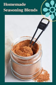 a jar filled with some kind of seasoning blend on top of a white table