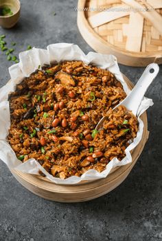 a bowl filled with food sitting on top of a table